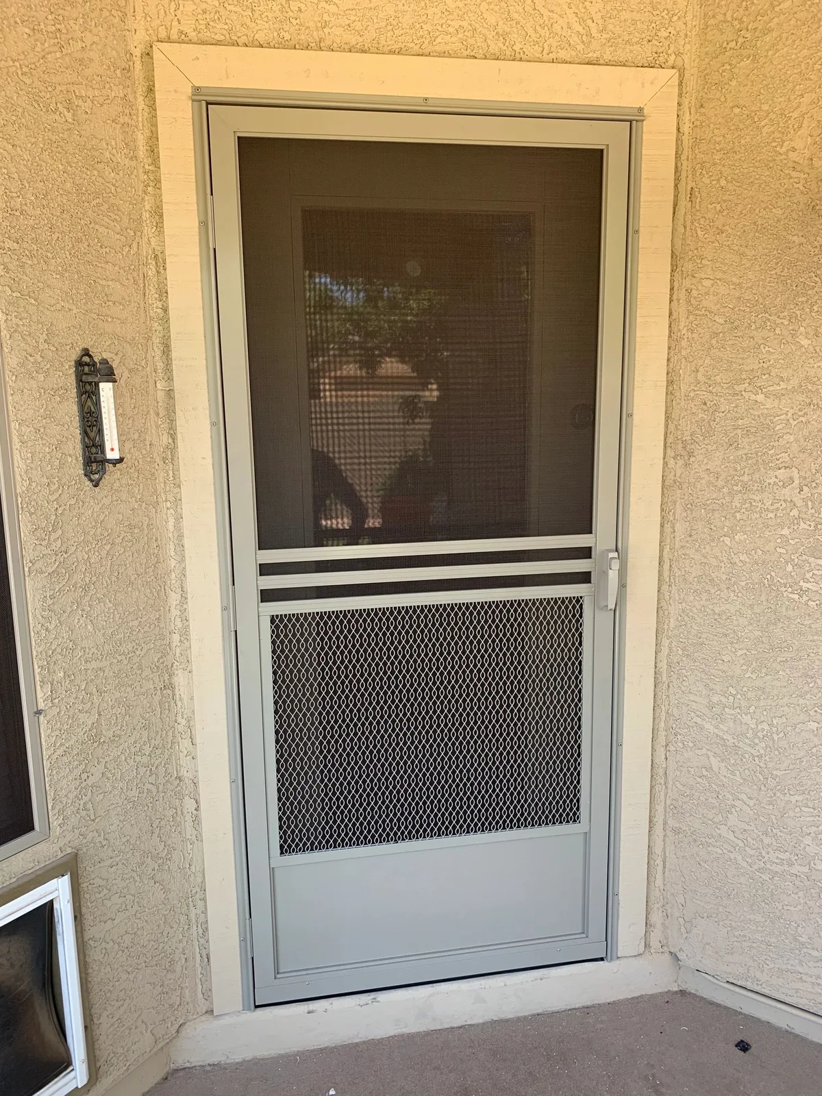 Hinged screen door shown by Arizona Screen Techs