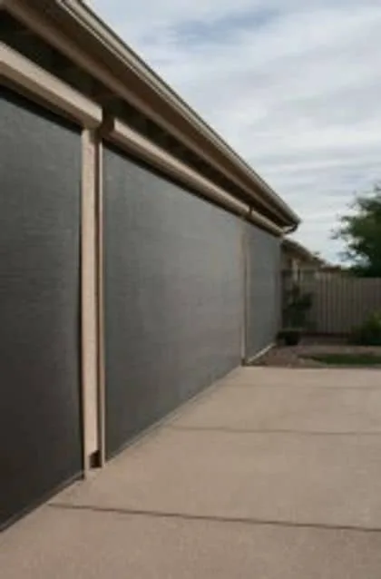 Exterior patio shade lowered beneath the cover